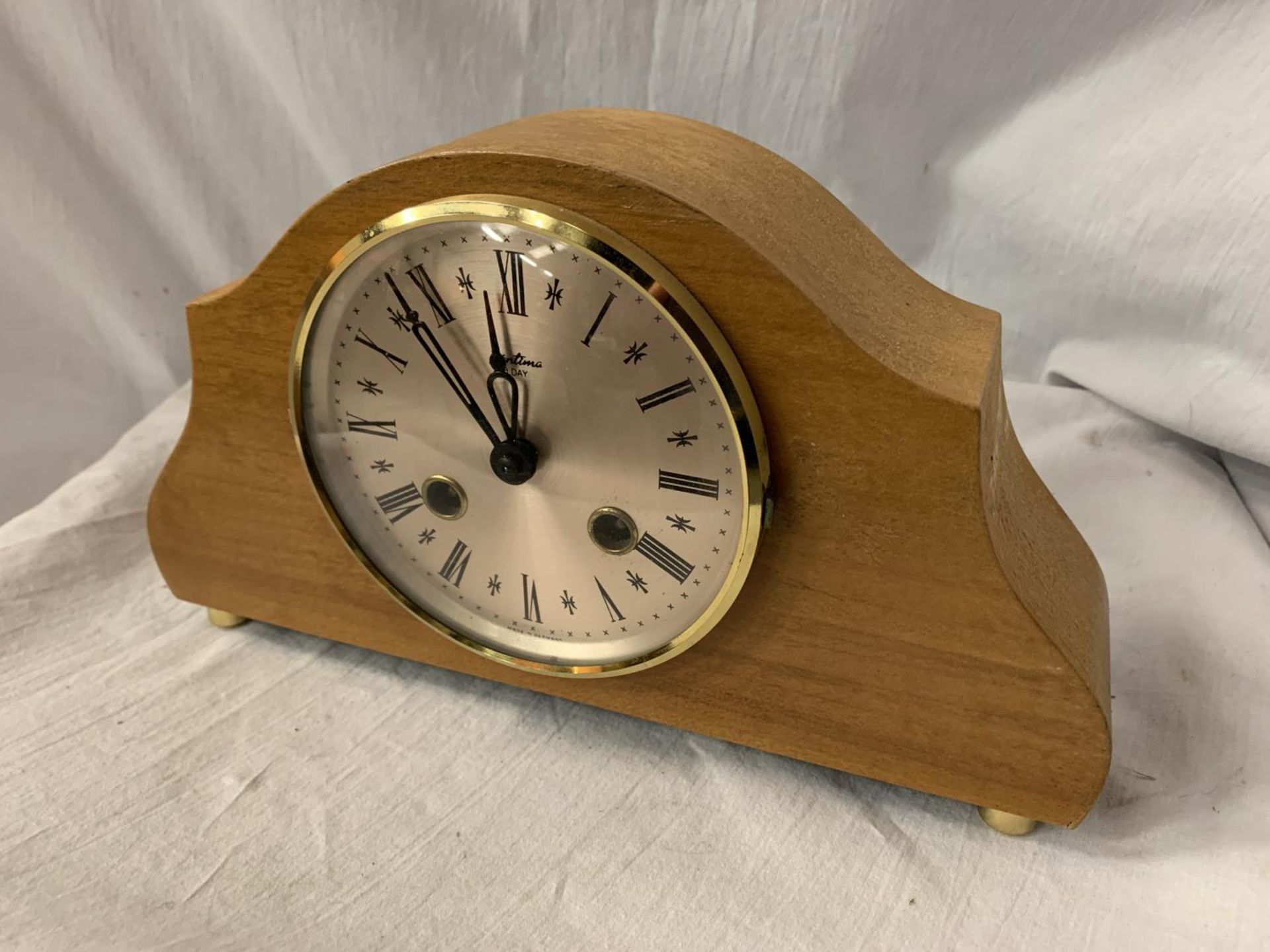 A BENTIMA EIGHT DAY VENEERED MANTEL CLOCK