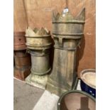 A PAIR OF KING AND QUEEN CHIMNEY POTS