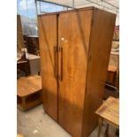 A RETRO TEAK TWO DOOR BEAUTILITY WARDROBE W: 36 INCHES