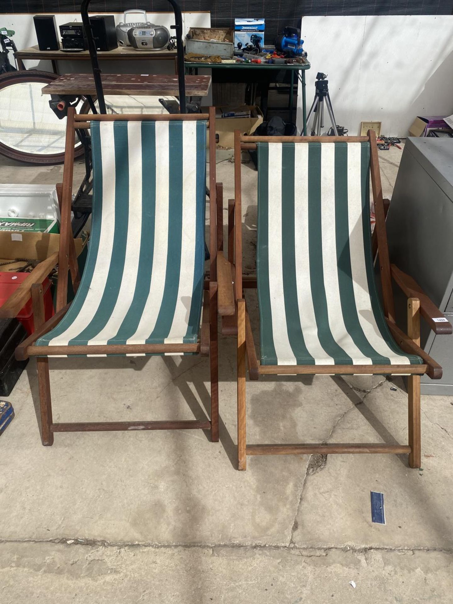 A PAIR OF WOODEN FRAMED DECK CHAIRS