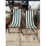 A PAIR OF WOODEN FRAMED DECK CHAIRS