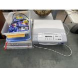 A BROTHER DCP-165C PRINTER WITH PHOTOGRAPHY PAPER AND A LARGE AMOUNT OF PRINTER CARTRIDGES