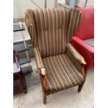 A PARKER KNOLL STYLE WINGED FIRESIDE CHAIR