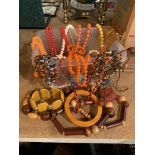 A PLASTIC CONTAINER OF COSTUME JEWELLERY TO INCLUDE MAINLY NECKLACES