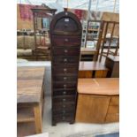 A TALL 'OCEANS APART' ELEVEN DRAWER CHEST OF DRAWERS WITH DOMED TOP, 14" WIDE