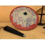 A PAIR OF ORIENTAL PAPER PARASOLS