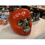 A HEAVY HAND PAINTED BOXER STYLE SKULL