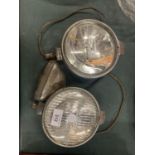 A PAIR OF VINTAGE LUCAS CAR HEADLIGHTS TO ALSO INCLUDE AN INDICATOR LAMP