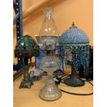 A BOXED TIFFANY LAMP, A BEADED ART NOUVEAU DOMED LAMP AND A GLASS OIL LAMP