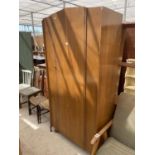 A MID 20TH CENTURY SINGLE DOOR OAK WARDROBE