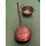 A HEAVY BRASS PRESERVING PAN AND A VINTAGE COPPER BED WARMER