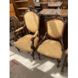 A VICTORIAN GENTLEMANS OPEN ARMCHAIR AND MATCHING LADIES NURSING CHAIR