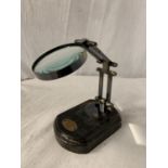 A MAGNIFYING GLASS ON A WOODEN BASE H: 10.5"