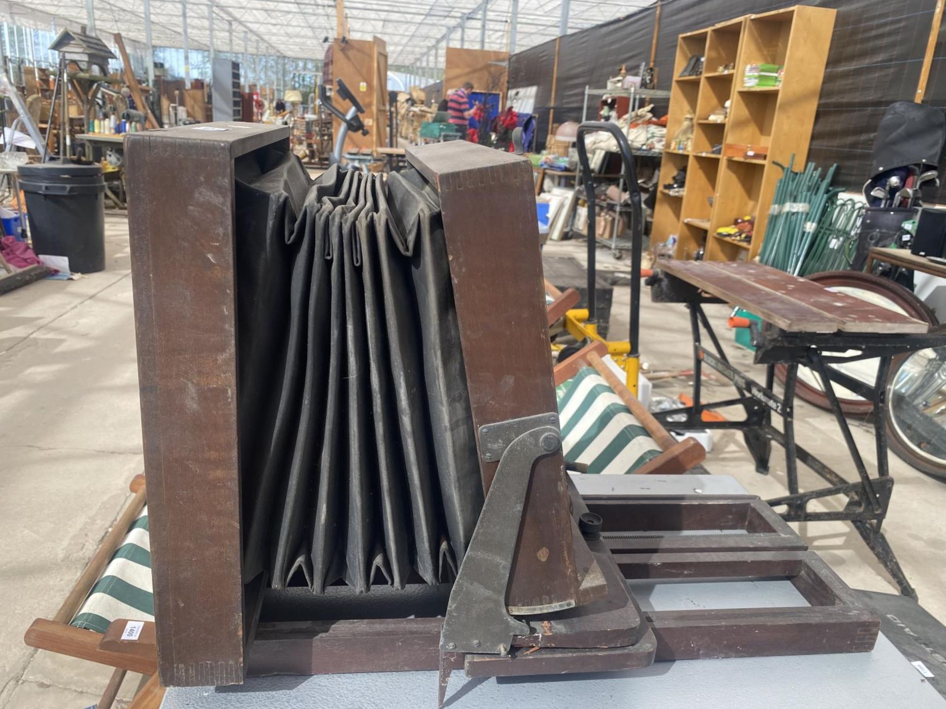 A VINTAGE WOODEN CAMERA