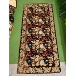 A FLORAL WALL HANGING APROXIMATELY W:150CM H:80CM