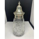 A SILVER TOPPED ROUND CUT GLASS SUGAR SHAKER