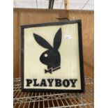 AN ILLUMINATED 'PLAYBOY' SIGN