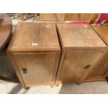 A PAIR OF MID 20TH CENTURY WALNUT BEDSIDE LOCKERS