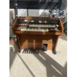 A HOWARD 245 ELECTRIC ORGAN BELIEVED IN WORKING ORDER BUT NO WARRANTY