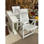 TWO WHITE PLASTIC GARDEN CHAIRS AND A TABLE