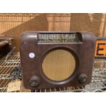 A VINTAGE BUSH MAINS VALVE RADIO IN BROWN BAKELITE CASE