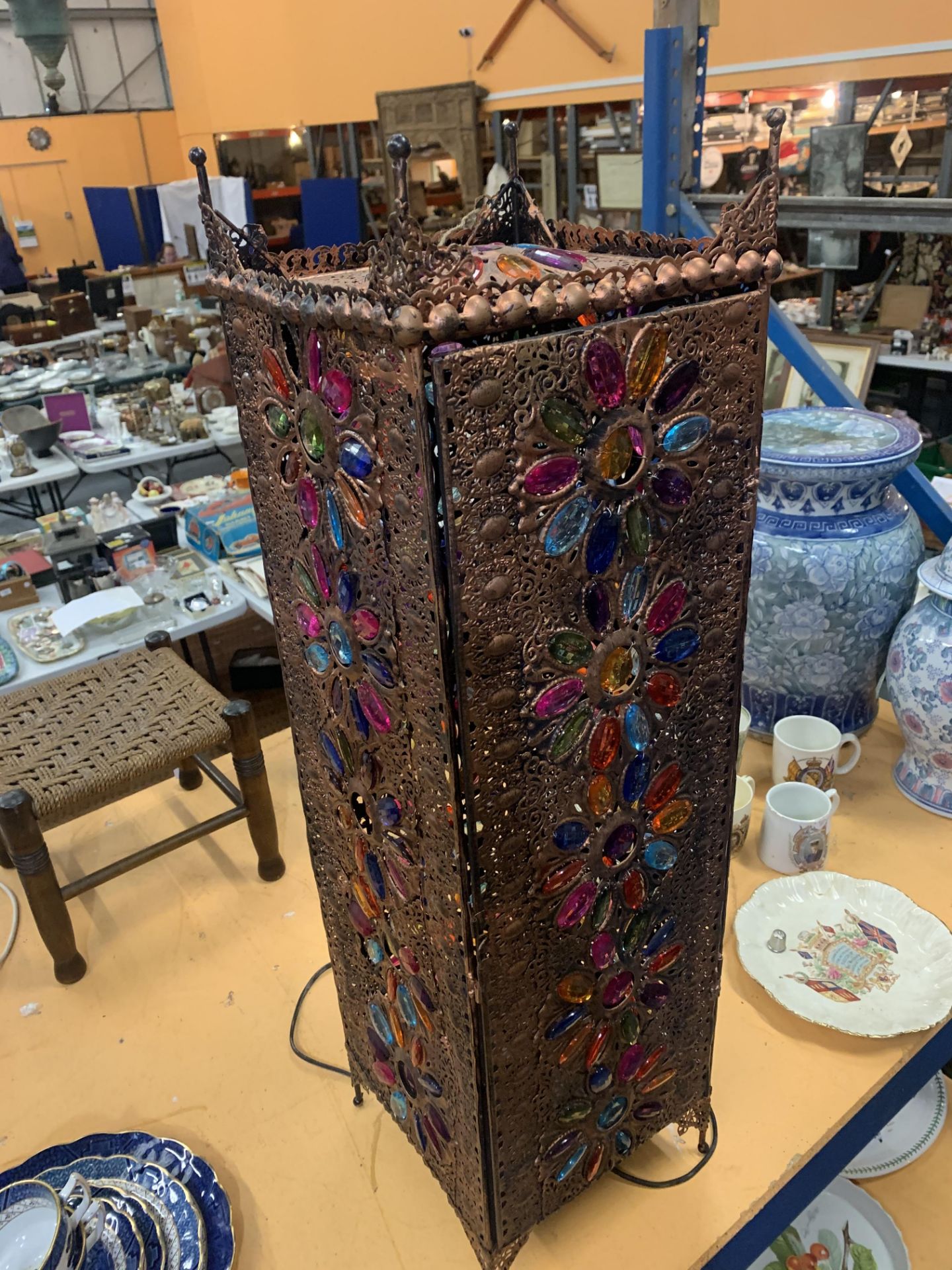 A MIDDLE EASTERN PIERCED GILT METAL FLOOR LANTERN WITH FLORAL MOTIFS HAVING COLOURED GLASS - Image 2 of 2