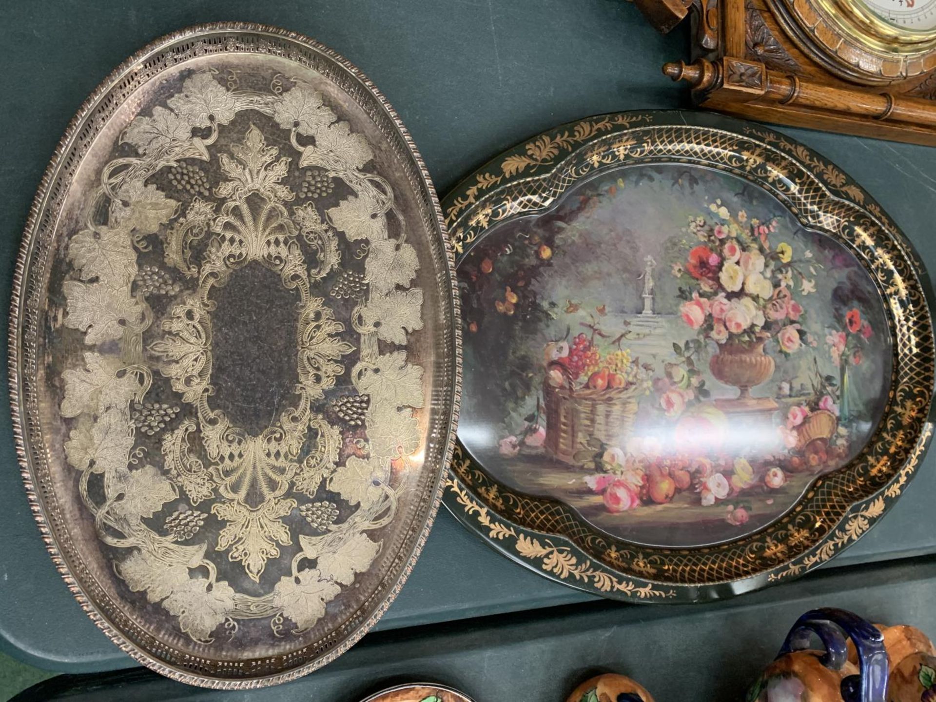 A SILVER PLATED VINERS OF SHEFFIELD SMALL BUTLER'S TRAY AND A LARGER FLORAL DECORATED TIN METAL