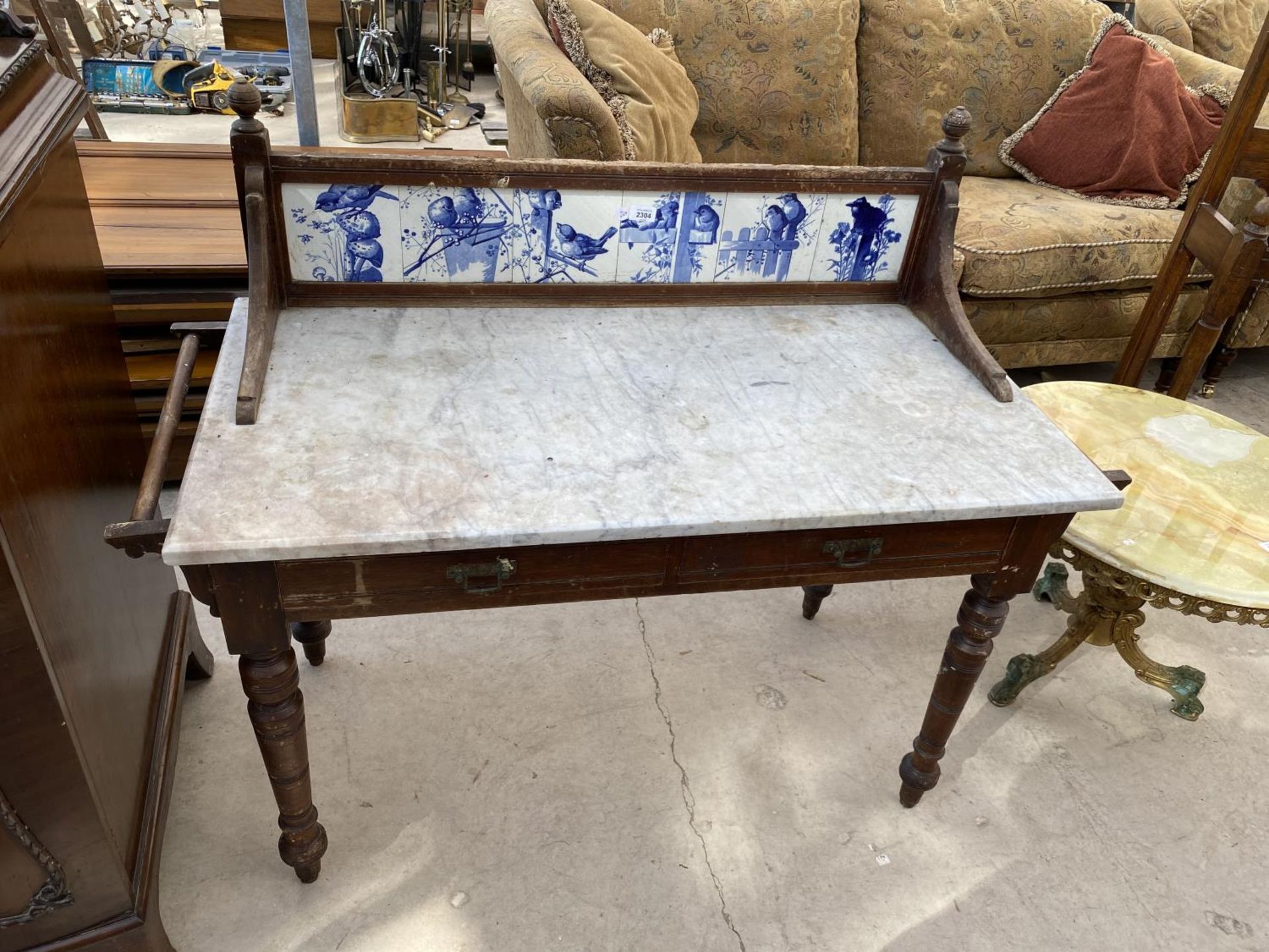 A VICTORIAN MARBLE TOPPED WASH STAND WITH TILED BACK 47" WIDE