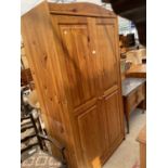 A MODERN TWO DOOR PINE WARDROBE, 38" WIDE