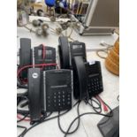 A GROUP OF FOUR TELEPHONES AND A STONE WARE VASE