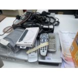 AN ASSORTMENT OF ELECTRICALS TO INCLUDE TWO DVD PLAYERS, REMOTE CONTROLS AND DVDS ETC