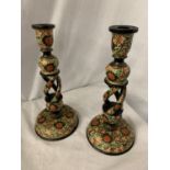 A PAIR OF DECORATIVE WOODEN CANDLESTICKS IN THE WILLIAM MORRIS STYLE H: 32CM