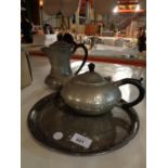 A GROUP OF PEWTER ITEMS TO INCLUDE A TEA POT, COFFEE POT AND PLATE
