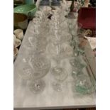 TWELVE CUT GLASS CHAMPAGNE COUPE GLASSES, SIX PALE GREEN TINGED WINE GLASSES AND TO ALSO INCLUDE A