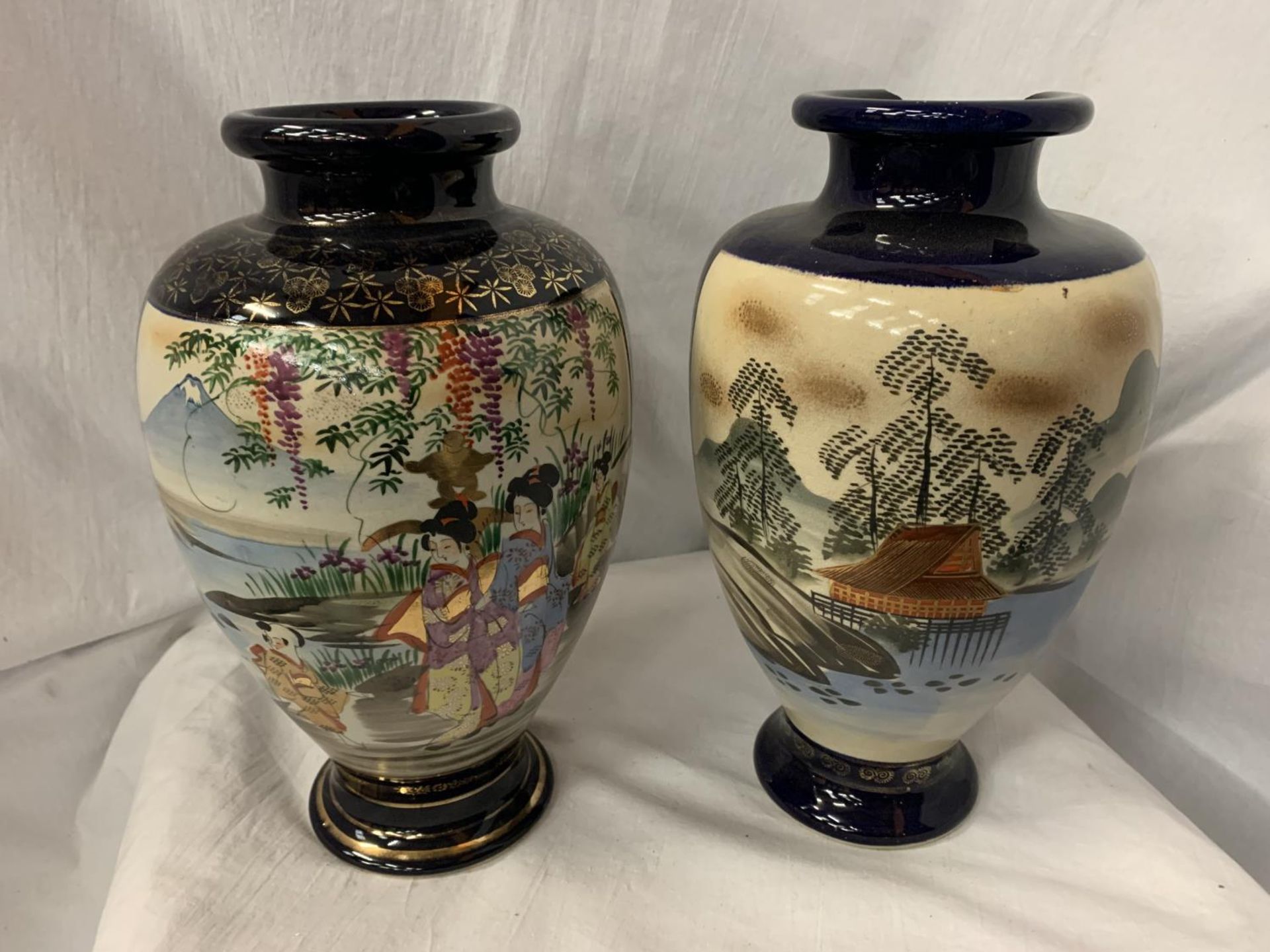 TWO ORIENTAL THEMED VASES (ONE FOR REPAIR) H: 30.5CM