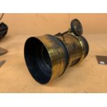 A VINTAGE BRASS CAMERA LENS WITH NO VISIBLE ENGRAVING, BELIEVED TO BE TAYLOR & HOBSON