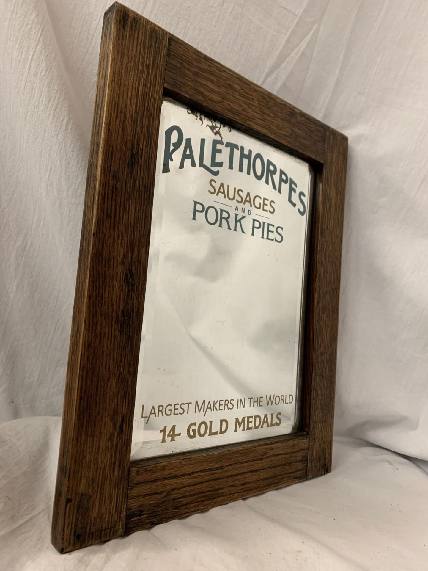 A WOODEN FRAMED ARTS AND CRAFTS STYLE ADVERTISING MIRROR FOR 'PALETHORPES SAUSAGES AND PORK PIES' - Image 3 of 4