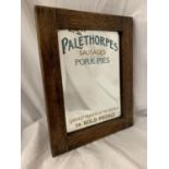 A WOODEN FRAMED ARTS AND CRAFTS STYLE ADVERTISING MIRROR FOR 'PALETHORPES SAUSAGES AND PORK PIES'