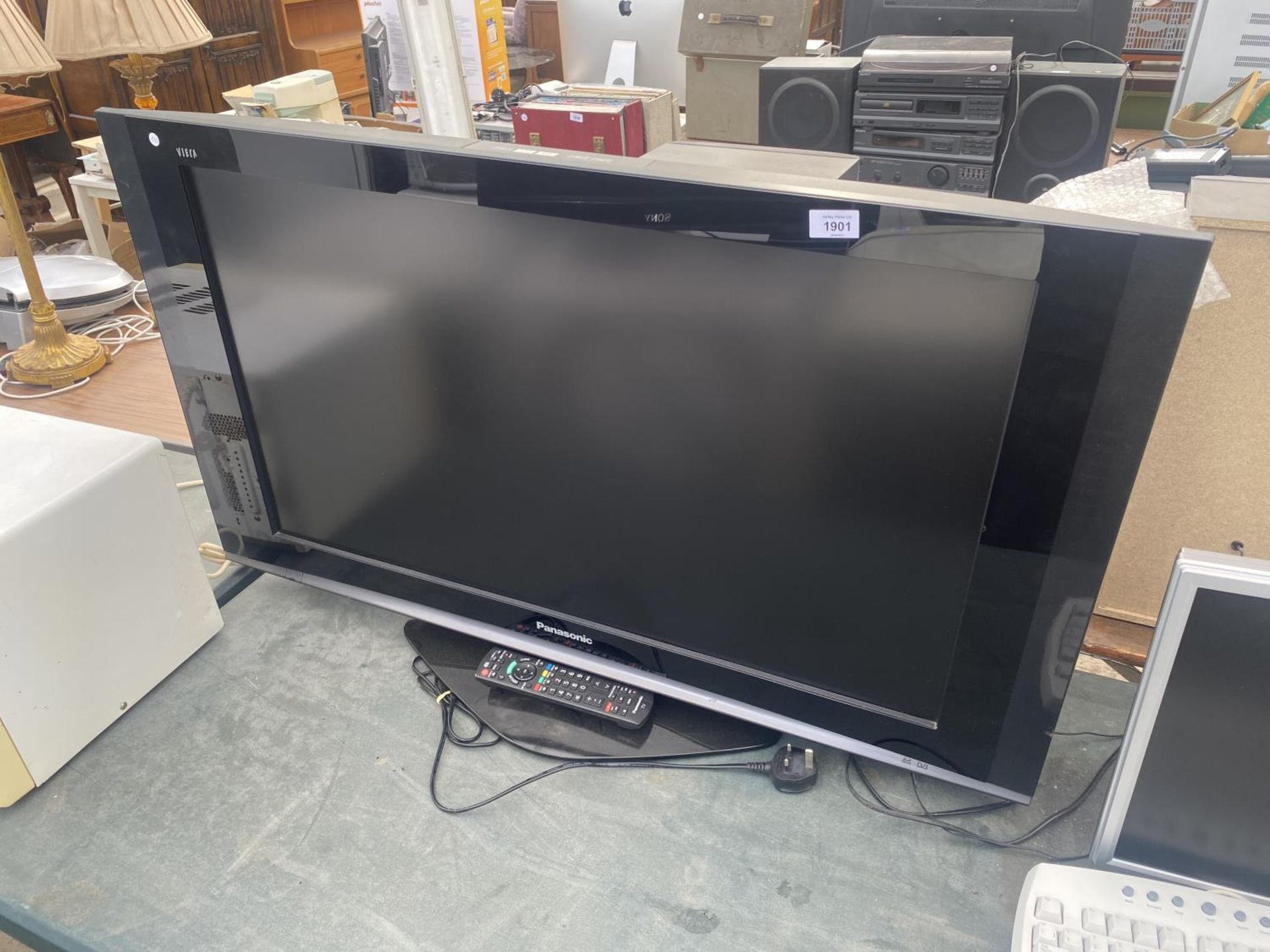 A 37" PANASONIC TELEVISION WITH REMOTE CONTROL BELIEVED IN WORKING ORDER BUT NO WARRANTY