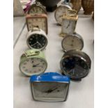 A SELECTION OF EIGHT ALARM CLOCKS AND A CARRIAGE CLOCK