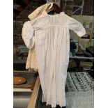 A VINTAGE LINEN CHRISTENING GOWN WITH BONNET AND A KNITTED SHAWL WITH BONNET