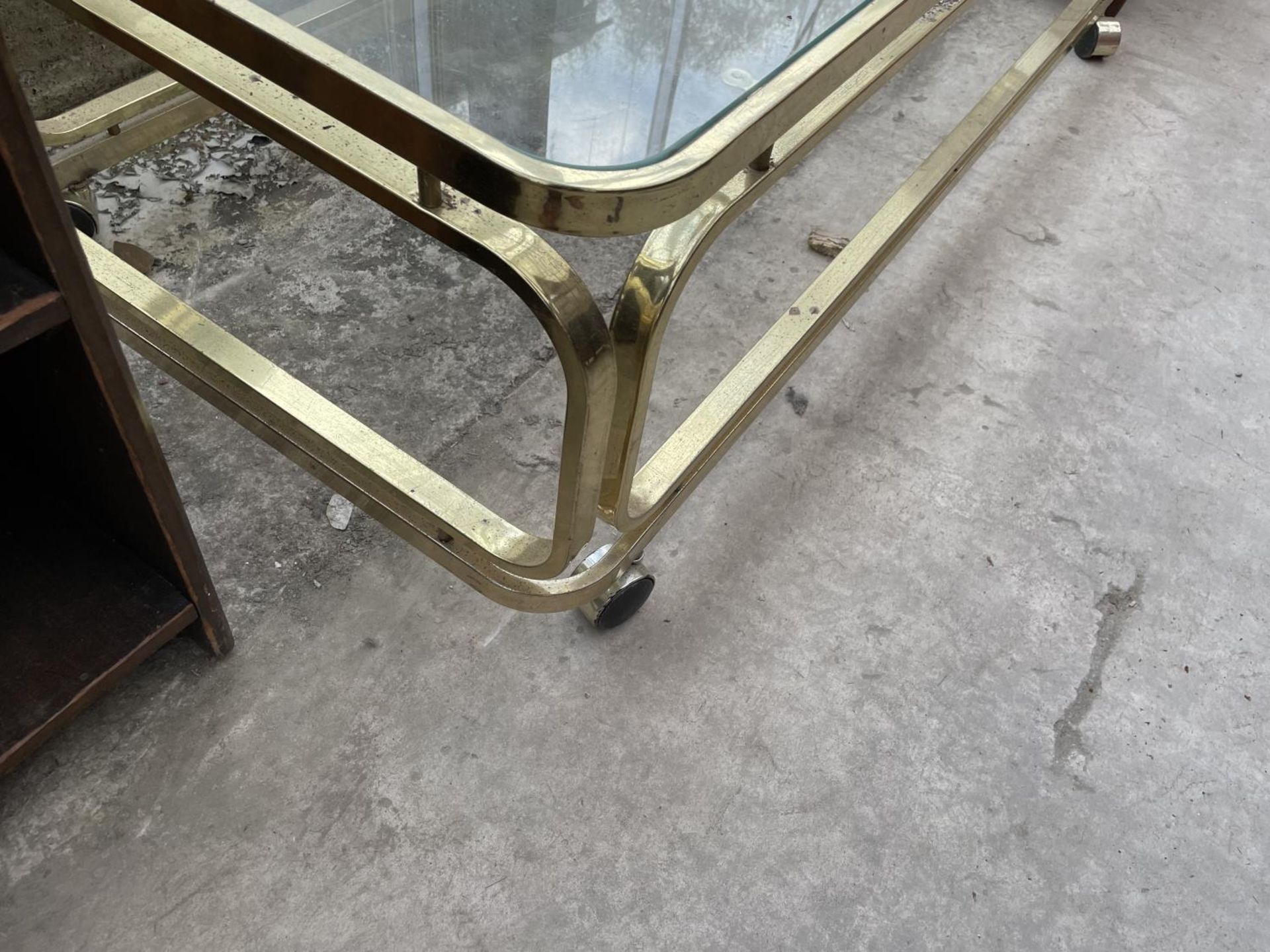 A MODERN BRASS FRAMED COFFEE TABLE WITH GLASS TOP, 54X24" - Image 3 of 3