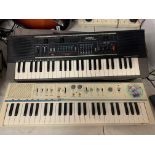 TWO ELECTRIC KEYBOARDS
