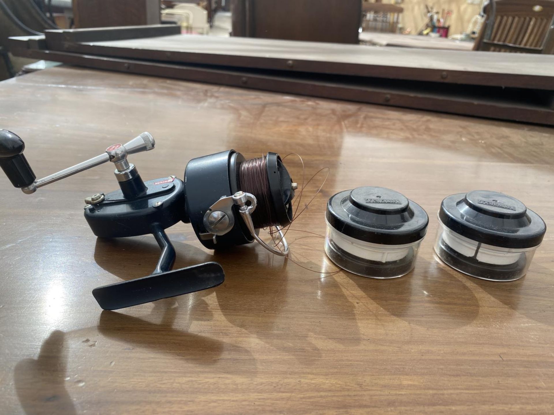 A GARCIA MITCHELL 410 FISHING REEL AND TWO SPARE SPOOLS