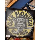 A METAL SIGN " GAS MONKEYS GARAGE"