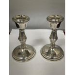 A PAIR OF HALLMARKED BIRMINGHAM CANDLESTICKS WITH WEIGHTED BASES