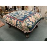 A SMALL VINTAGE FOOTSTOOL WITH MAHOGANY LEGS AND A TAPESTRY TOP 37CM X 25CM X 15CM