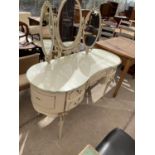 A CREAM AND GILT DRESSING TABLE WITH TRIPLE MIRROR