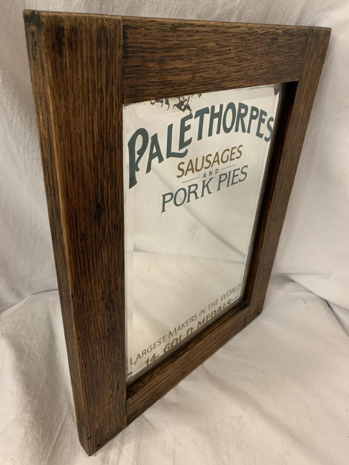 A WOODEN FRAMED ARTS AND CRAFTS STYLE ADVERTISING MIRROR FOR 'PALETHORPES SAUSAGES AND PORK PIES' - Image 2 of 4