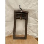 A VINTAGE WOODEN WIND OUT STAND